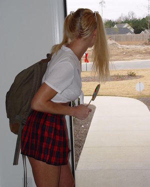 18 year old girl Katie Lewis stands naked after undressing in her bedroom